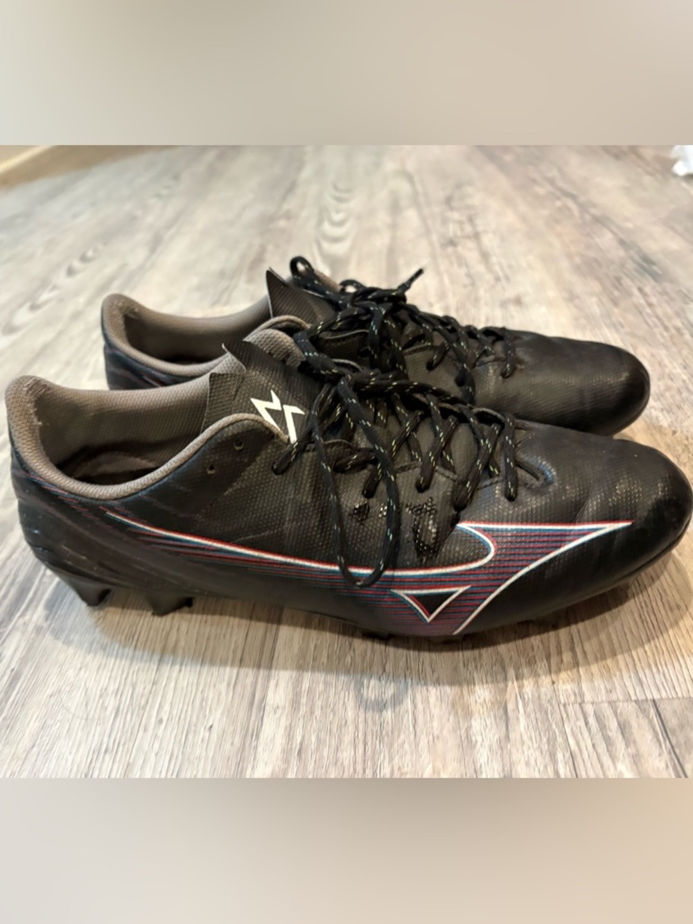 Mizuno Black Soccer Cleats with Red and Blue Accents
